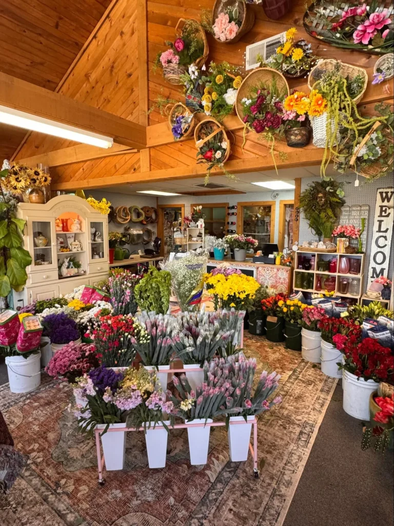 Inside Azar's Flower Gallery featuring bouquets, flowers, and floral displays